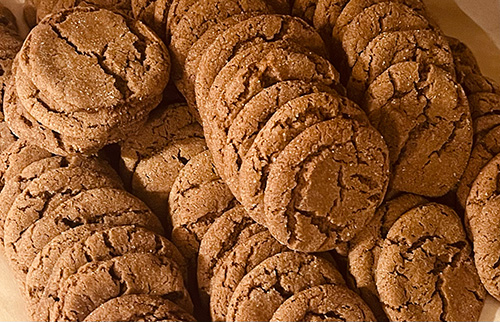 Image of a large completed batch of ginersnap cookies.